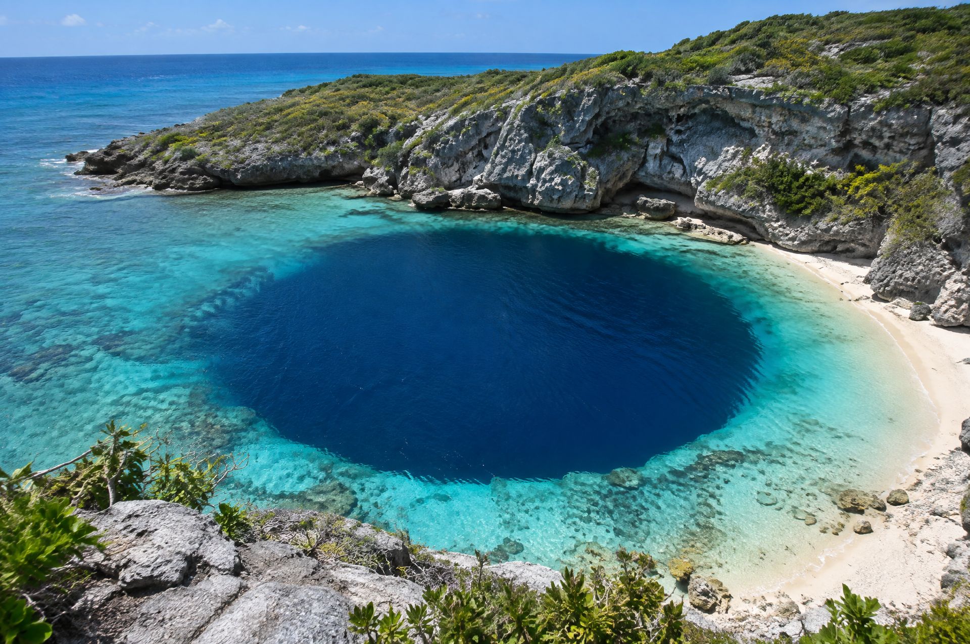Dean's Blue Hole on Long Island, ringed by limestone cliffs